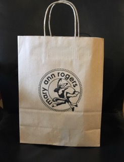 Brown printed paper carrier bags size 240x110x310mm